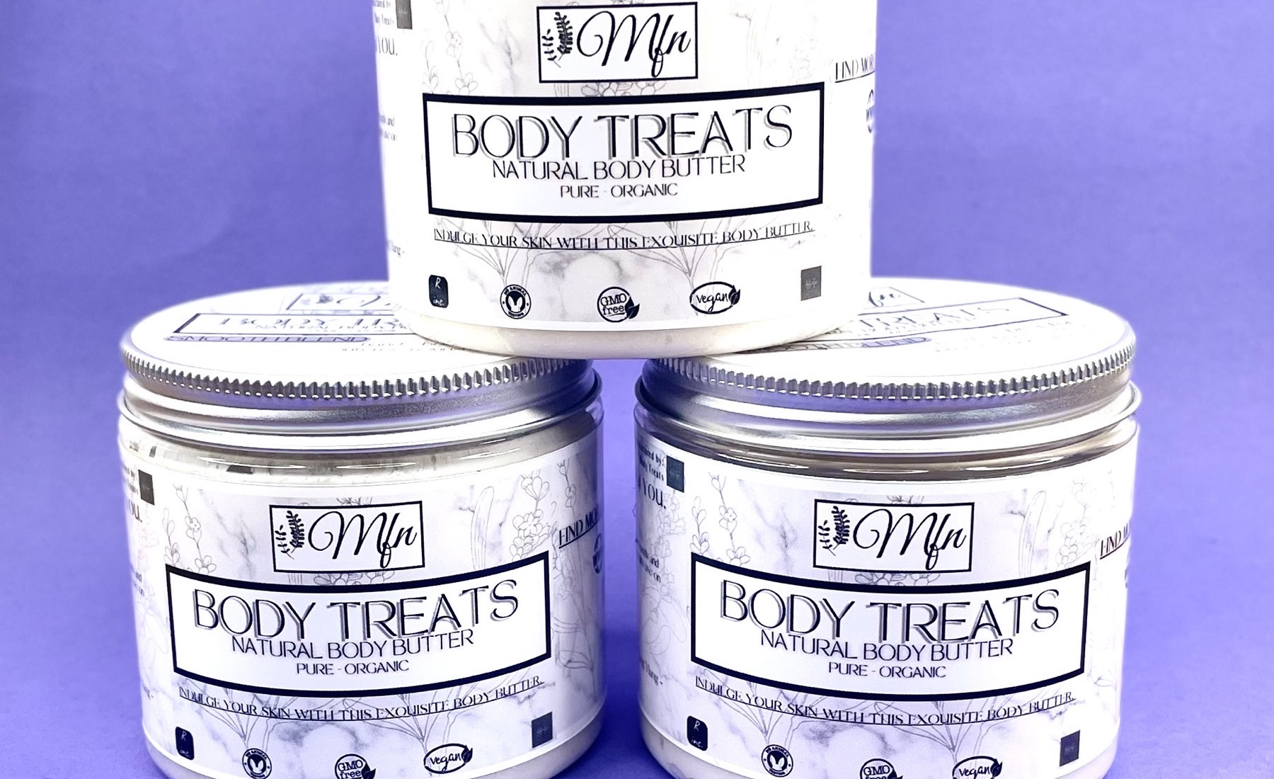 Three jars of Body Treats natural body butter