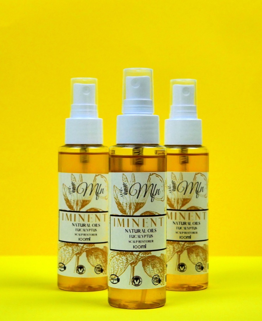Iminent natural hair and scalp oil, photographed in the Mundo Fit Natural range